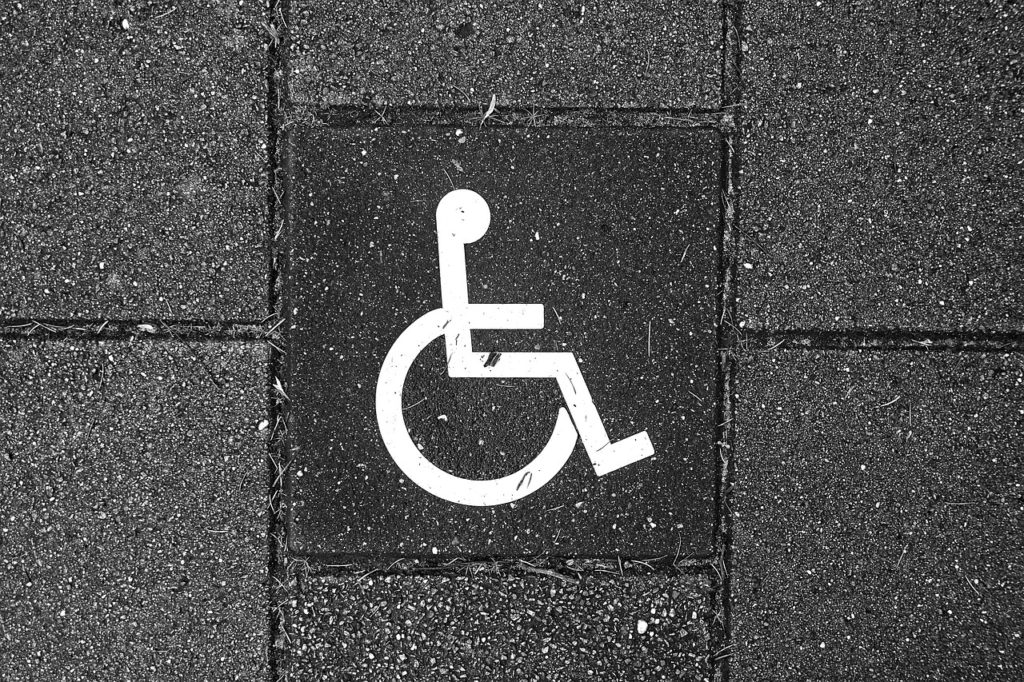 Wheelchair accessibility symbol on concrete